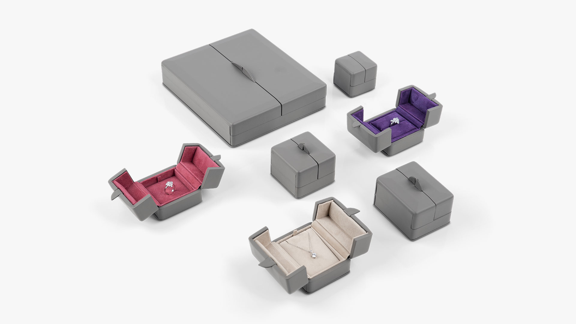 Arrangement der Etuiserie in verschiedenen Ausführungen in der Außenfarbe Grey Brown.